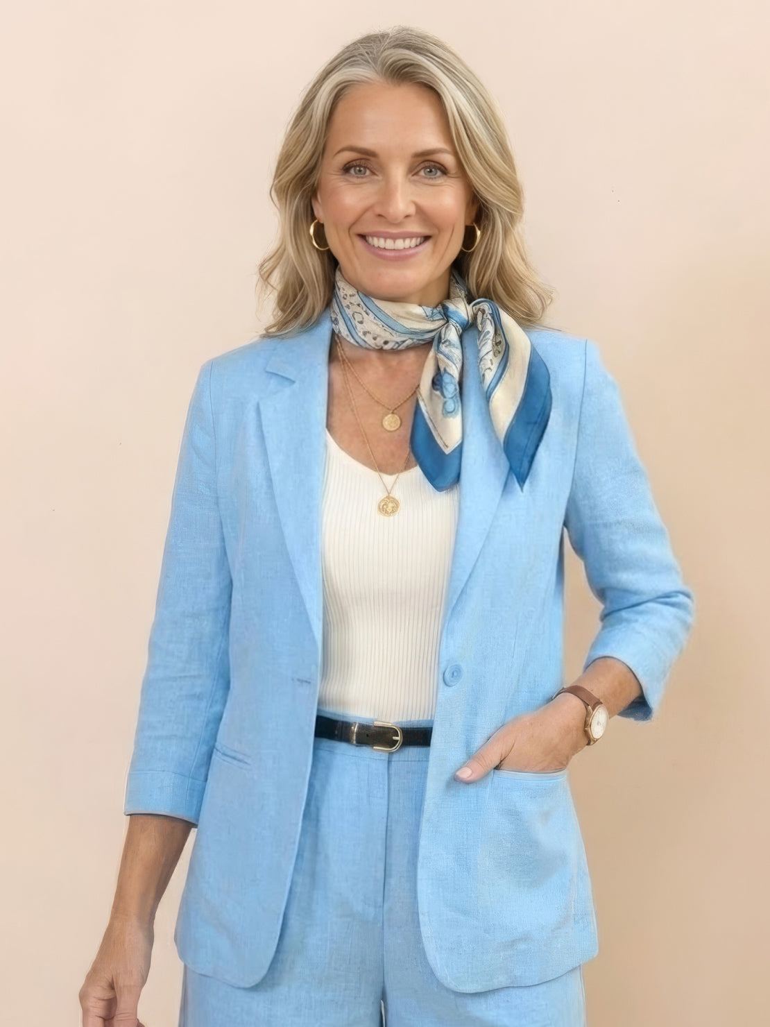 Woman wearing a polished blazer and high-waisted shorts two-piece set in a monochrome style