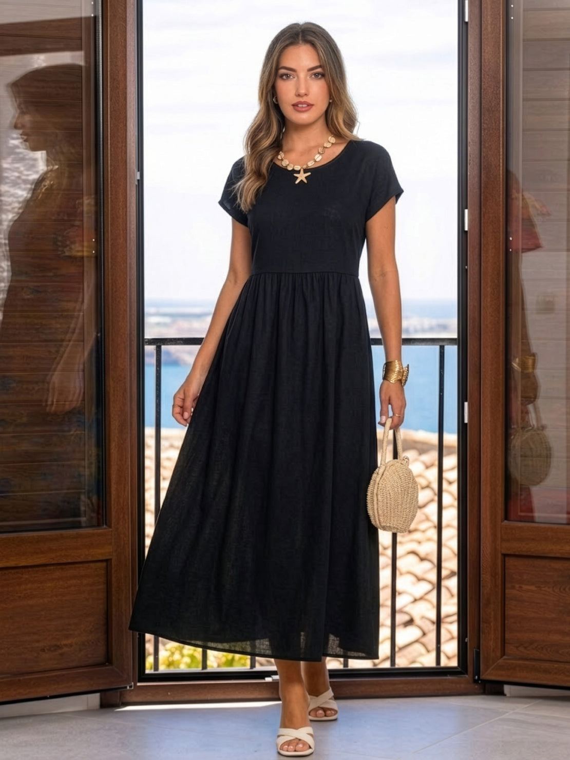 Woman wearing capped-sleeve voluminous pleated midi dress with flowing skirt and pockets