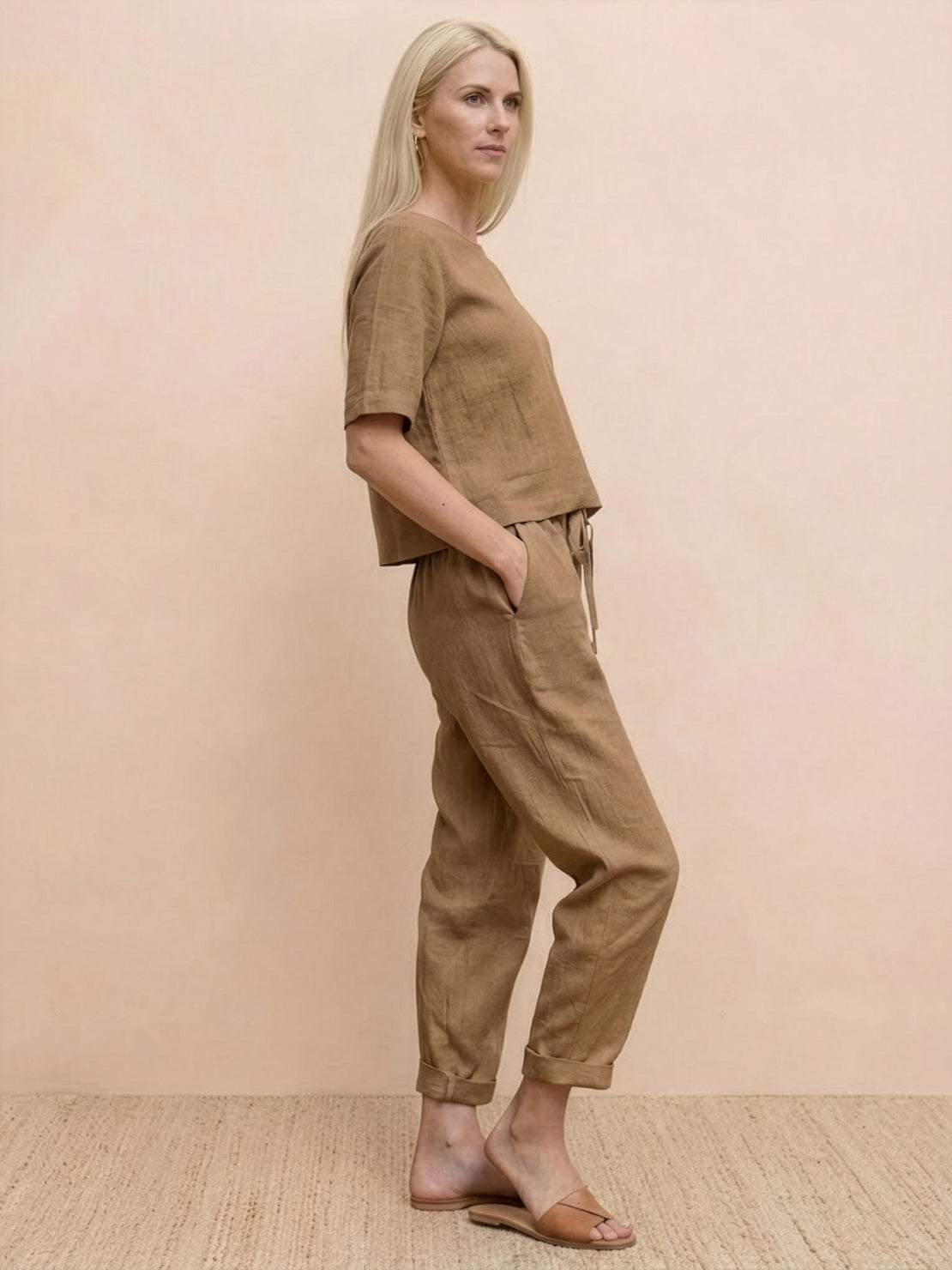 Woman wearing a breathable, breathable cotton linen set with relaxed fit and monochrome design