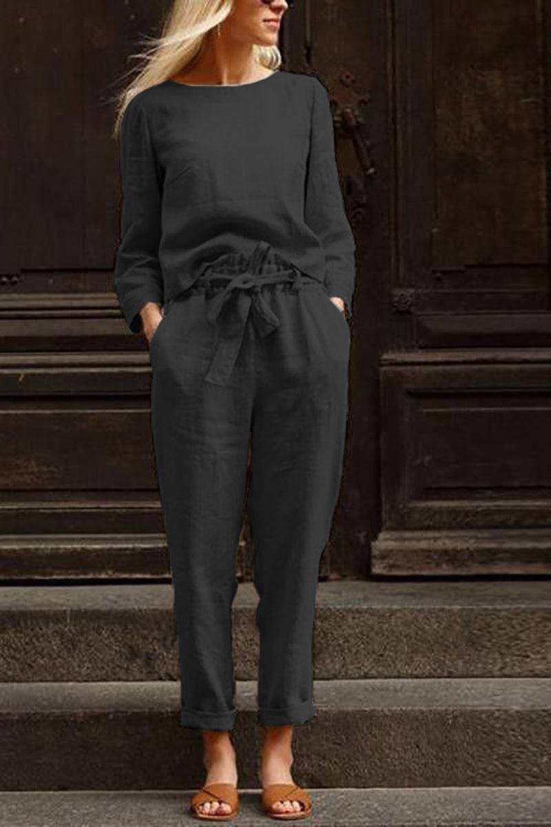 Woman wearing black cotton-linen monochrome longline top and wide-leg pants set with relaxed fit and tied waist
