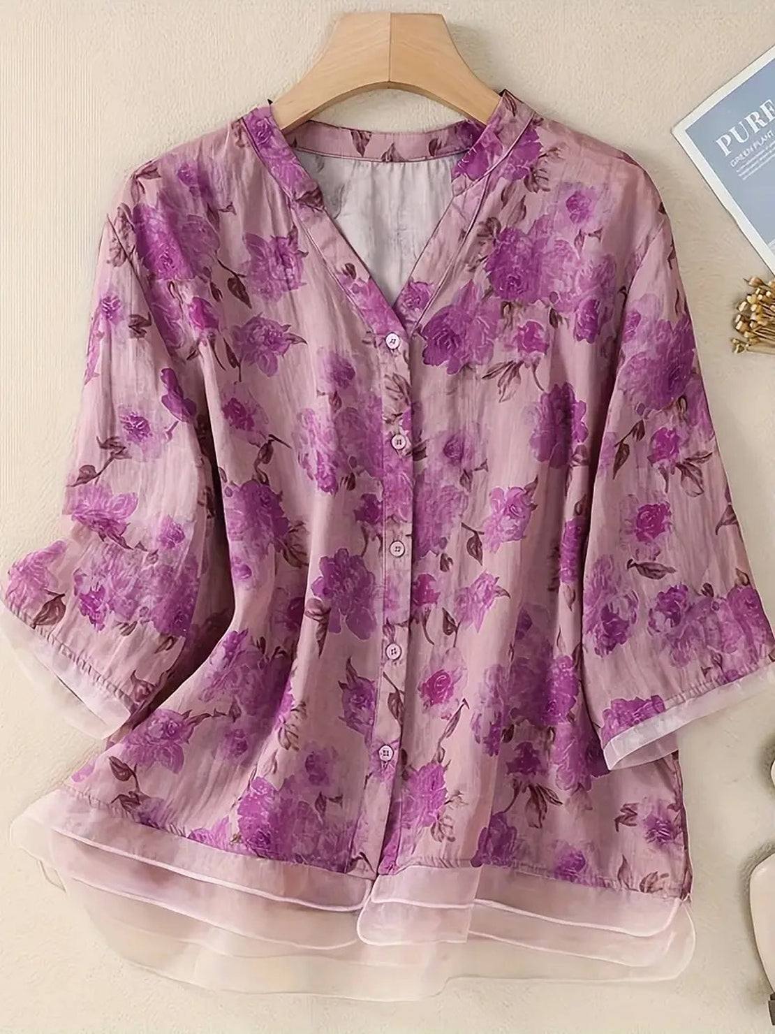 French boutique style elegant organza floral print blouse on wooden hanger