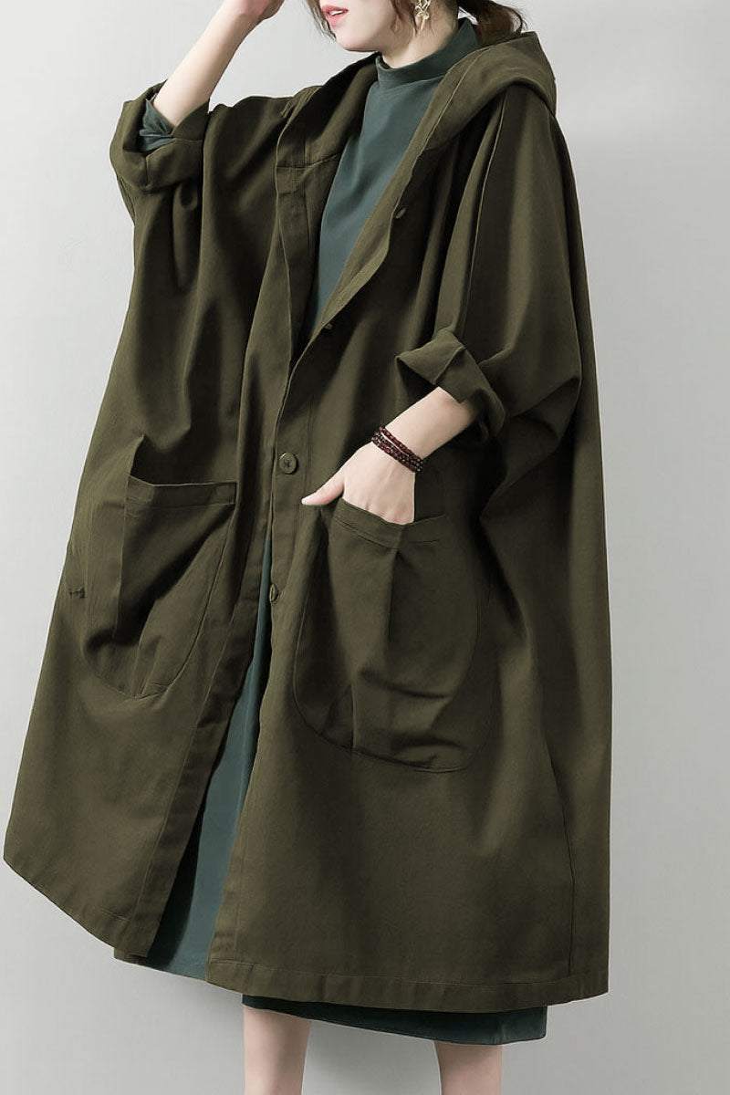Oversized water resistant windbreaker jacket with hood and large pockets in olive green