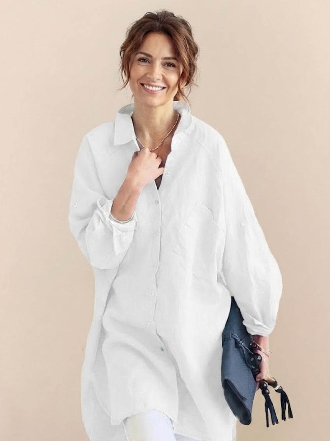 Oversized linen shirt with relaxed fit, back gathers, and button detail in soft cotton-linen blend