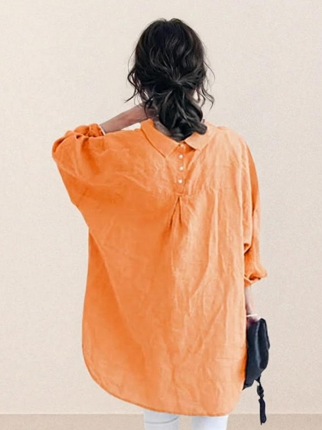 Oversized linen shirt made from breathable cotton-linen blend with relaxed fit and back button detailing