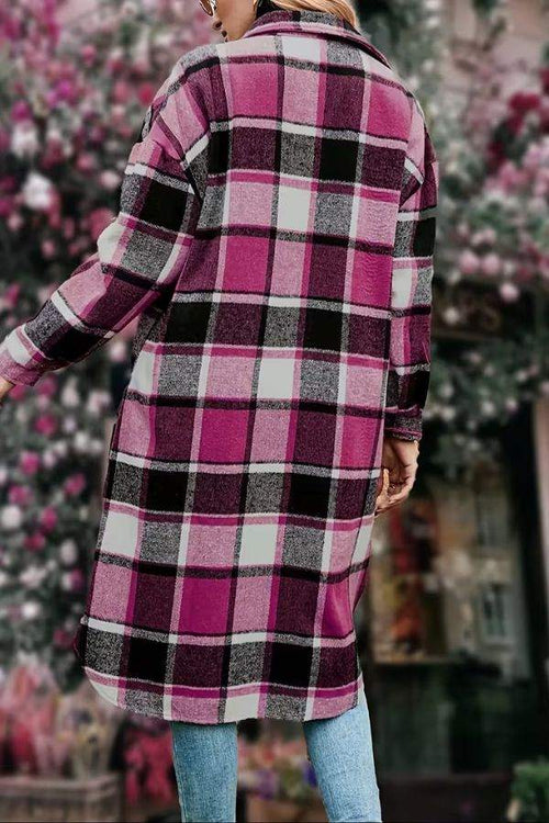 Oversized medium-length plaid overshirt in pink and black plaid pattern, cozy wool blend layer.