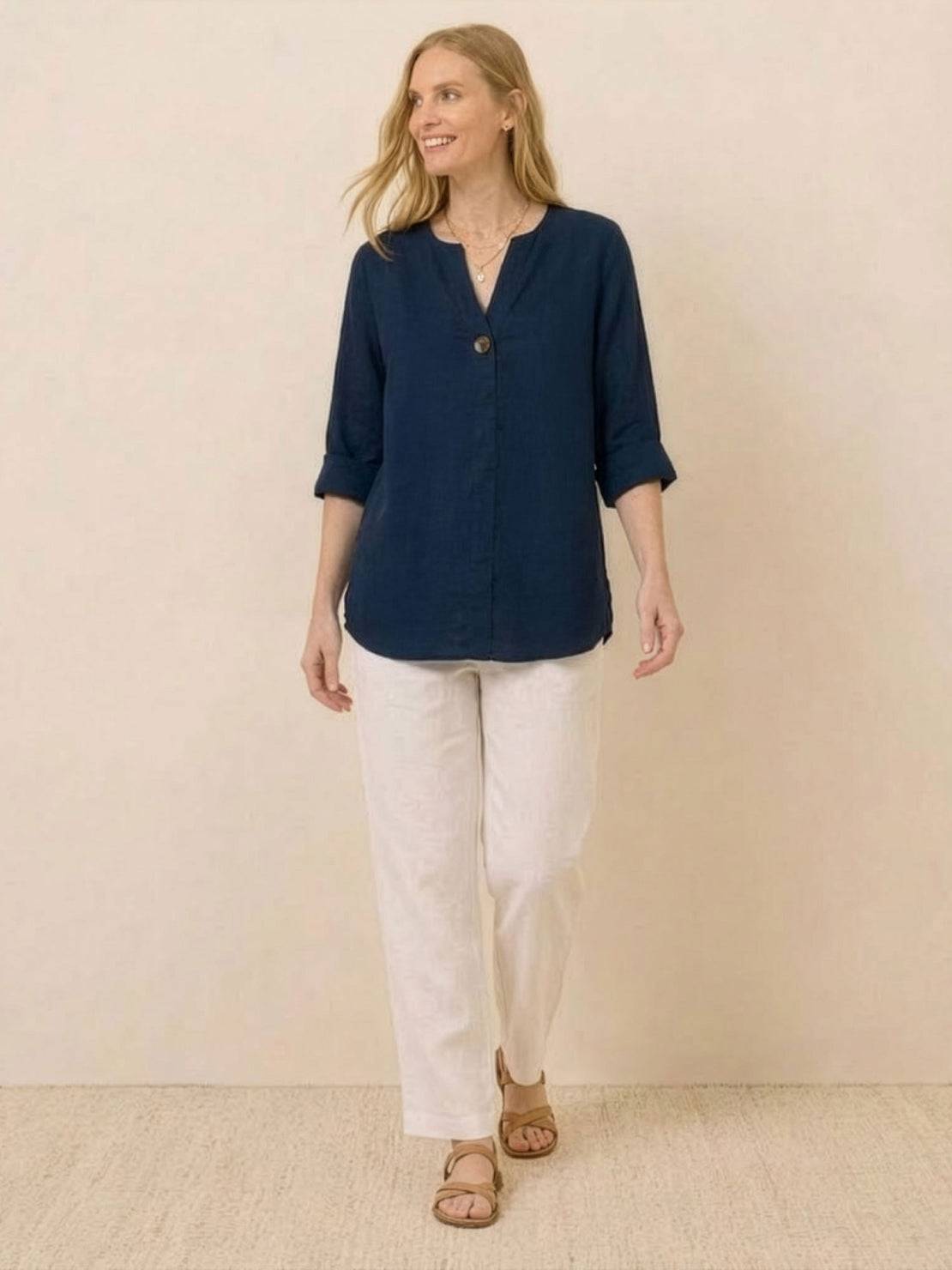 white pure linen age-defying shirt with button detail on hanger