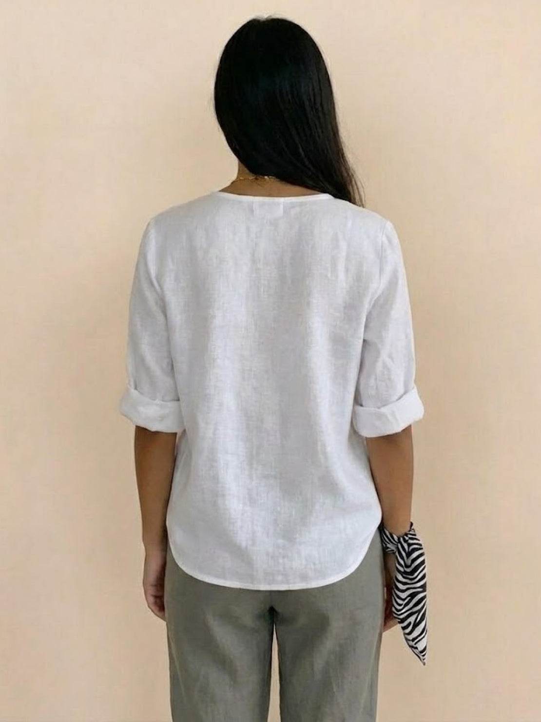 White pure linen age-defying shirt with button detail on mannequin