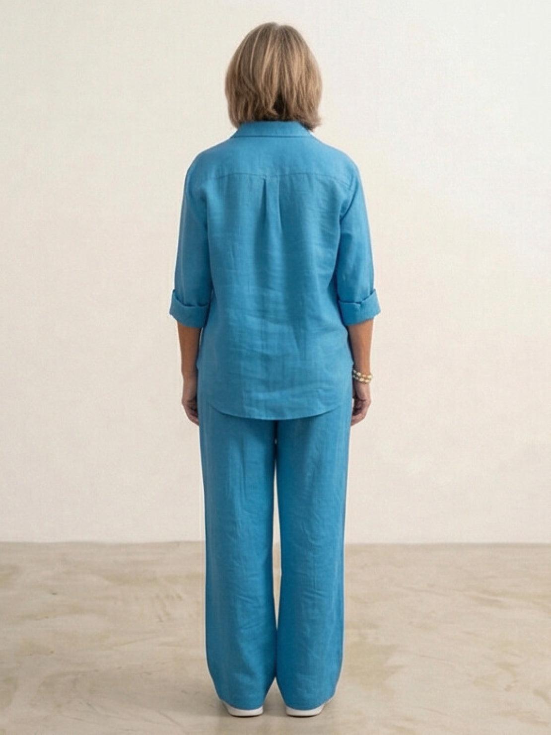 Woman wearing oversized 100% cotton shirt and wide-leg pants co-ord set