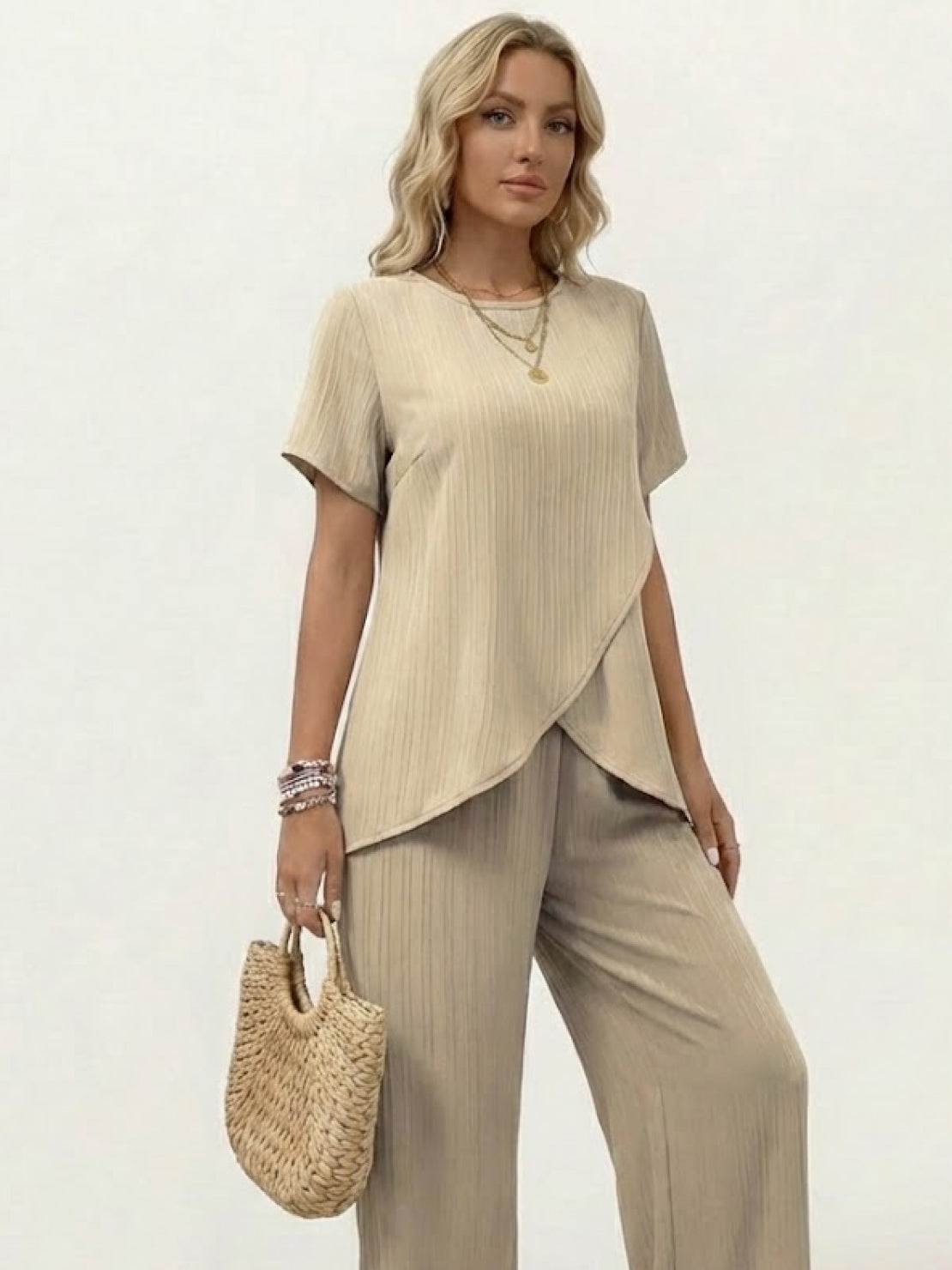 Two-piece textured elegance outfit with asymmetrical top and wide-leg pants