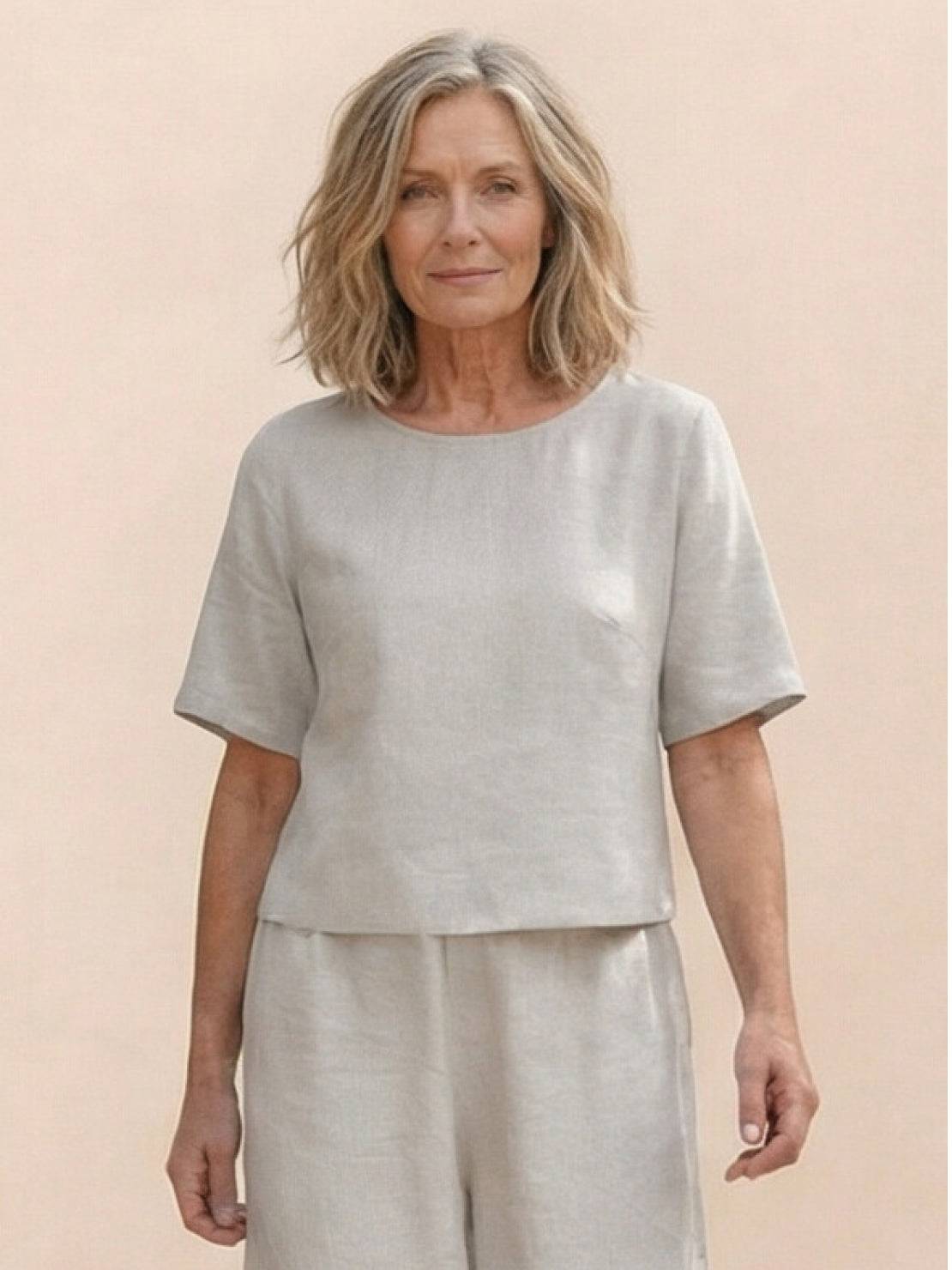 woman wearing loose fit co-ord set with soft-tailored top and wide-leg bottoms