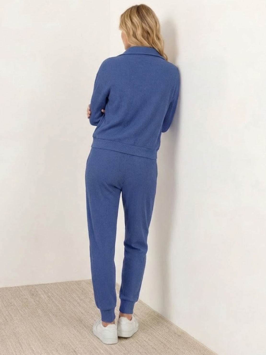 Unisex half-zip pullover and matching sweatpants set in soft fabric for casual and travel wear