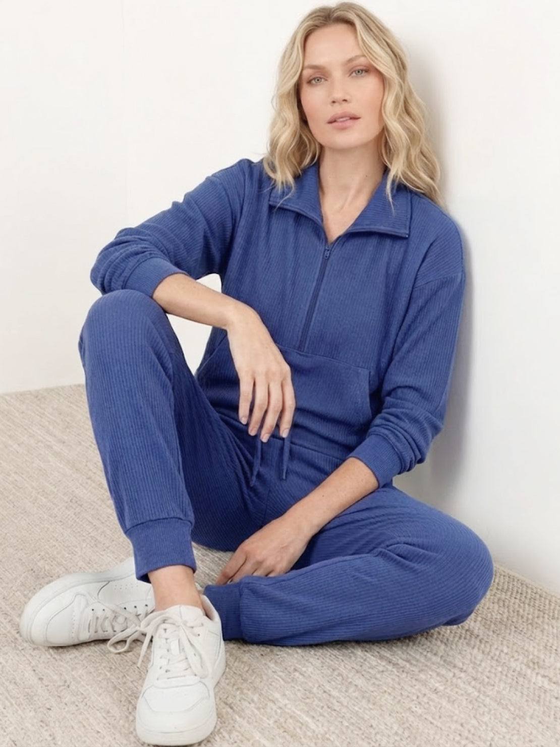 Unisex half-zip pullover and sweatpants set in soft fabric with relaxed fit for everyday comfort and casual wear