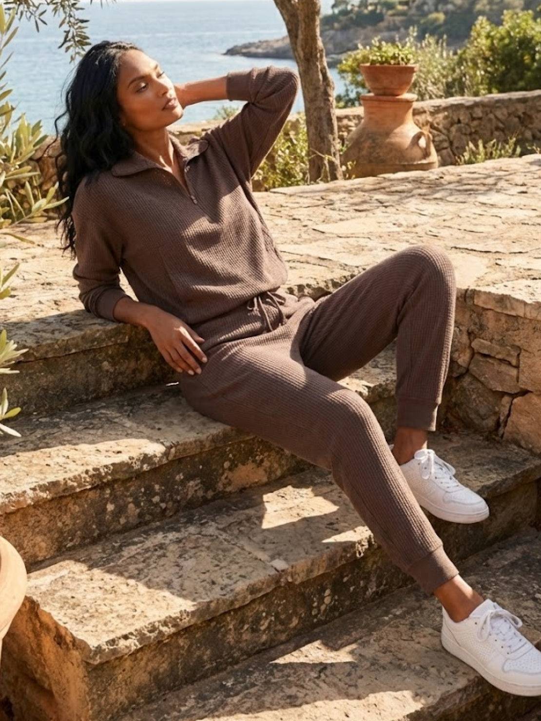Unisex half-zip pullover and sweatpants set in relaxed fit and soft fabric for everyday comfort and travel