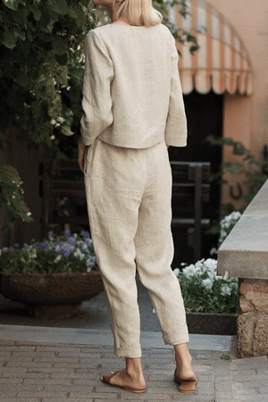 Woman wearing relaxed cotton-linen monochrome longline top and wide-leg pants set outdoors