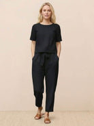 Woman wearing 100% cotton linen monochrome set with short-sleeve top and straight-leg pants in breathable fabric
