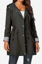 Women's water resistant hooded striped windbreaker jacket with oversized fit and multiple pockets