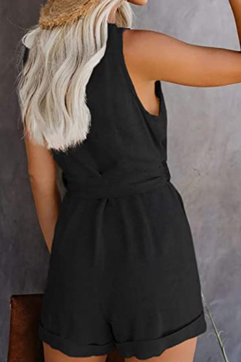 Woman wearing black alluring V-neck layered romper with waist tie, sleeveless and casual style from the back view
