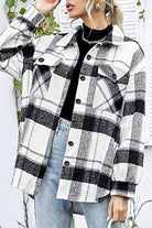 Women’s long sleeve plaid flannel shirt in black and white check pattern with button closure and casual fit