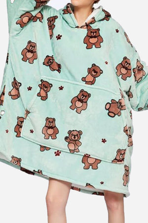 Snuggly oversized hooded fleece sweater with bear print, soft, warm, and cozy blanket-style design.