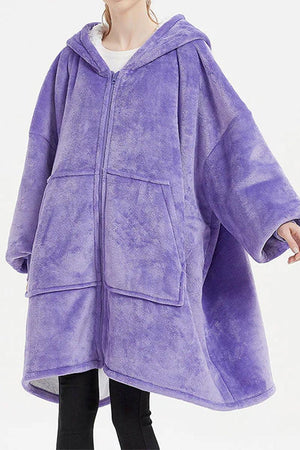Oversized ultra soft hooded blanket with zipper, large front pockets, and cozy purple fleece material.