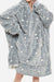 Oversized gray Lazy Fleece Blanket Sweater with white stars, hood, and front pocket, soft sherpa fleece material for warmth and comfort