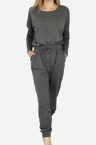 Cozy Chic Two-Piece Sweatsuit set in dark gray with long-sleeve top and high-waisted pants with pockets, perfect for travel and casual wear.
