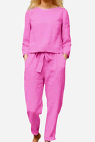 Retro Monochrome Linen two-piece set in bright pink linen fabric with long sleeves and relaxed fit pants.