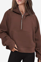 Cozy oversized half-zip fleece pullover sweatshirt in brown with kangaroo pocket and relaxed fit