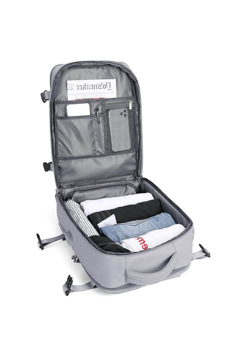 Chic Wanderlust Waterproof Backpack open showing organized compartments with clothes and accessories inside