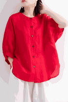 Red relaxed loose breathable linen blouse with button-down front and three-quarter sleeves