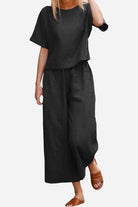 Black loose fit co-ord set with short sleeves and wide-leg pants for relaxed comfort