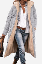 Long Sherpa-lined hooded teddy coat with quilted gray exterior and cozy beige sherpa interior, styled with casual denim and accessories.