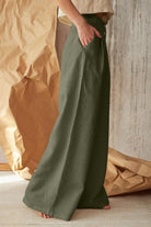 Side view of olive green button front high waist palazzo pants for women