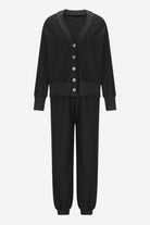Black two-piece knitwear set with buttoned cardigan and relaxed pants, soft polyester fabric, comfortable and versatile design.