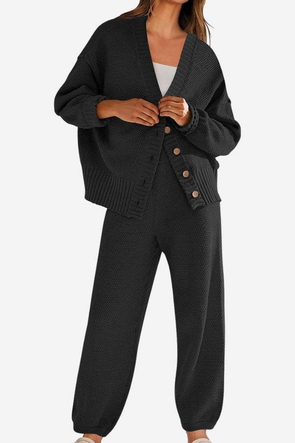 Two-piece knitwear relaxed co-ord set in black with oversized cardigan and matching pants, soft polyester fabric, casual and versatile style.