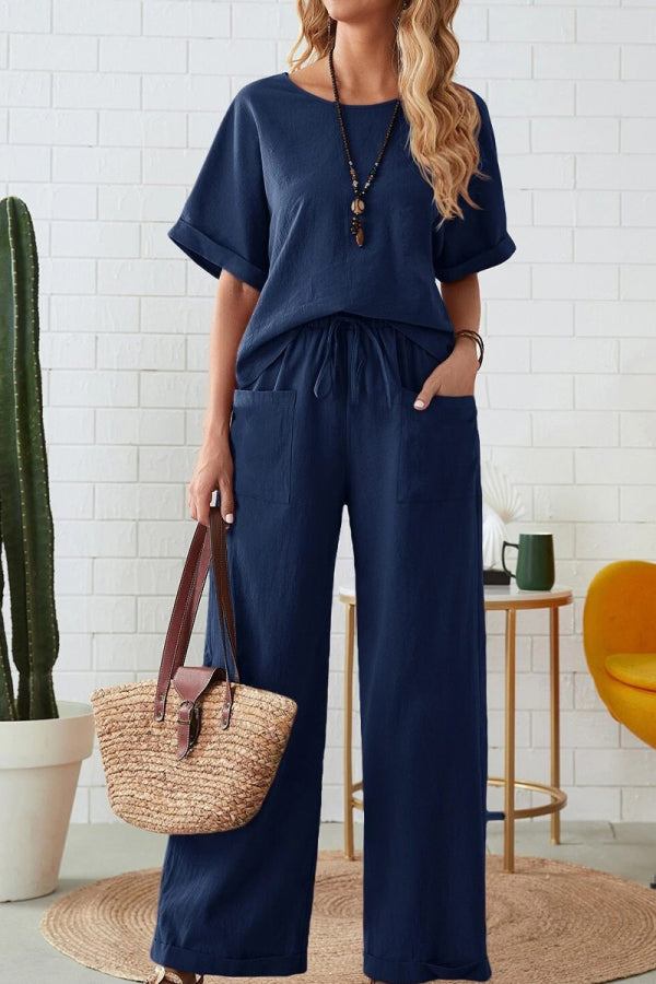 Rolled cuff top and patch pocket pants set in navy blue, relaxed fit, casual women's loungewear with breathable fabric and deep pockets.
