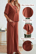 woman wearing rust-colored rolled cuff top with deep patch pocket pants set in silky cotton blend