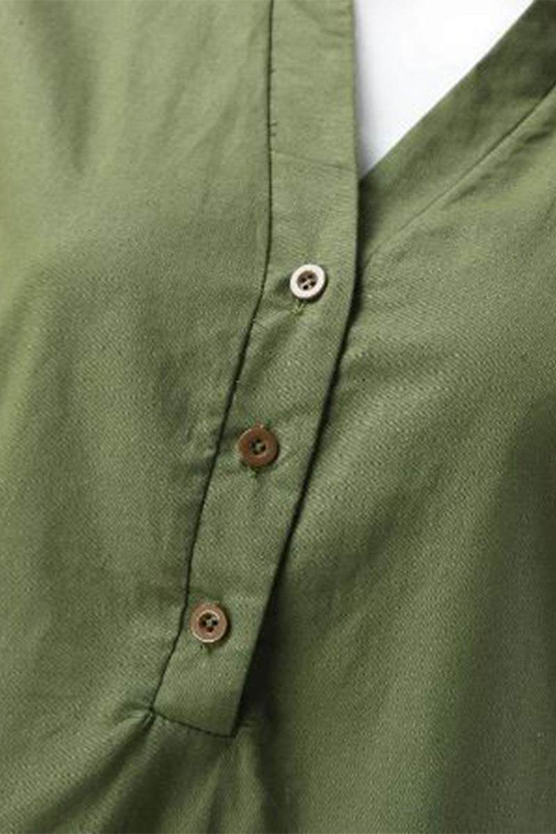 Close-up of olive green short-sleeved V-neck top with buttons and soft cotton fabric