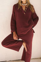 woman wearing burgundy two-piece oversized set with long sleeves and wide pants for multi-weather comfort