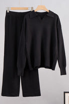 black knitted plush two-piece set with polo collar and wide-leg pants hanging on wooden hangers