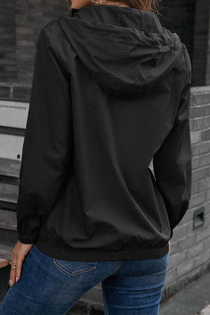 Black outdoor hooded raincoat and windbreaker jacket worn with elastic sleeves and hem