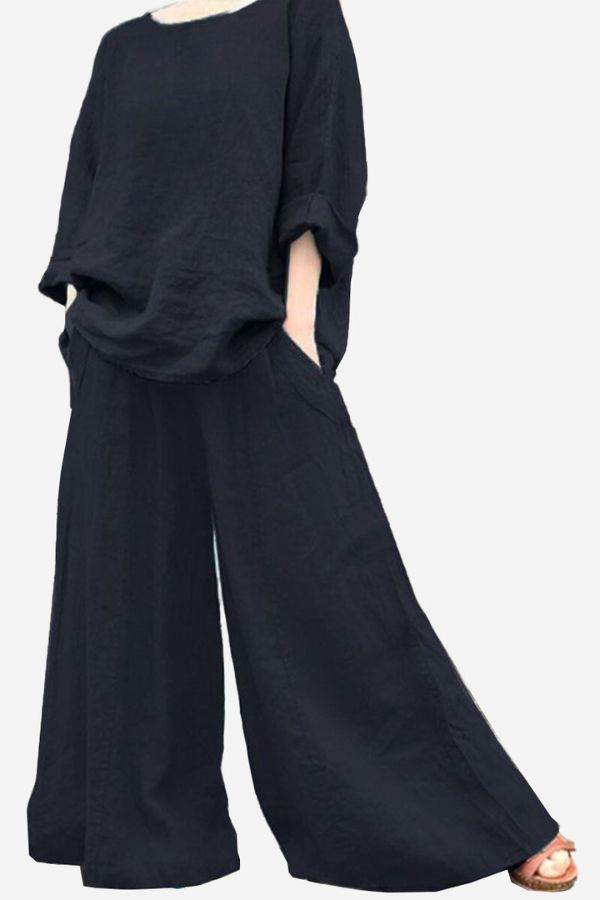Black wide leg pants with pockets paired with loose black top, bohemian style outfit