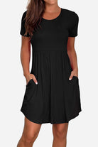 Black short-sleeved pleated dress with pockets and a modest, flattering cut
