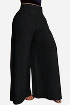 Black high waist wide leg pants with relaxed fit and lightweight fabric for comfortable wear.