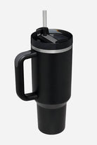 Black indestructible travel cup with handle, spill-proof lid, and detachable straw, made of stainless steel.