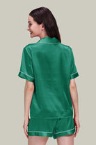 Back view of woman wearing green Mulberry Silk buttoned short set nightwear with short sleeves and shorts