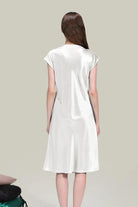 Back view of elegant white Mulberry Silk V-Neck Nightgown with short sleeves on model against gray background