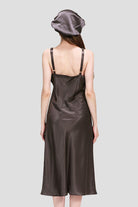 Back view of a woman wearing a brown Mulberry Silk Elegant Night Dress and matching silk cap