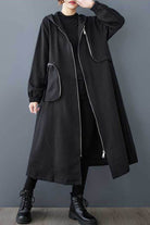 Black ZipLine oversized long coat with zippered pockets and waffle texture, modeled in casual pose, one size fits all.