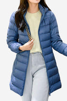 Women’s lightweight blue water-resistant hooded puffer coat for travel and everyday wear